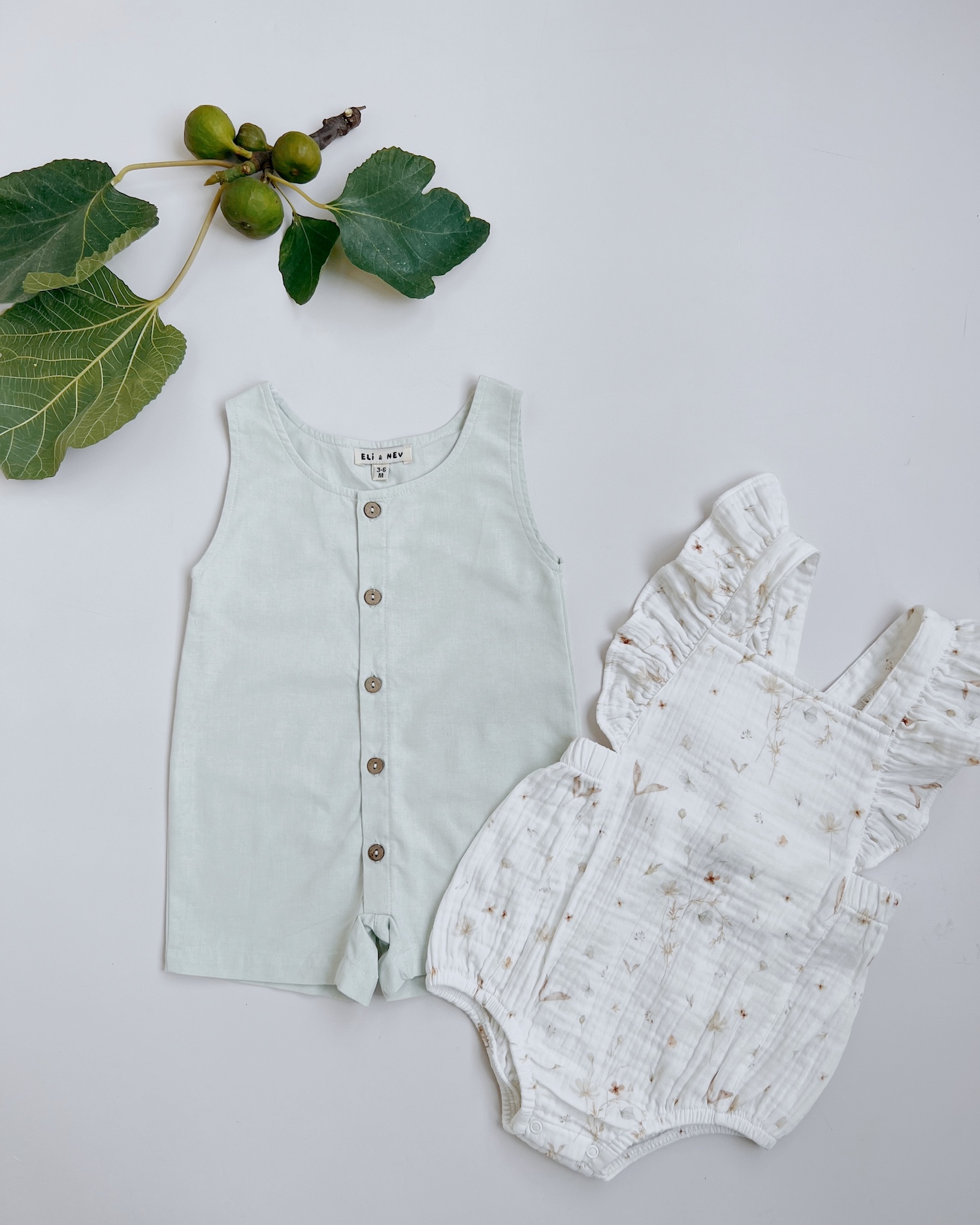 Triebios baby clothing, organic cotton, green jumper and flower pattern roomper.